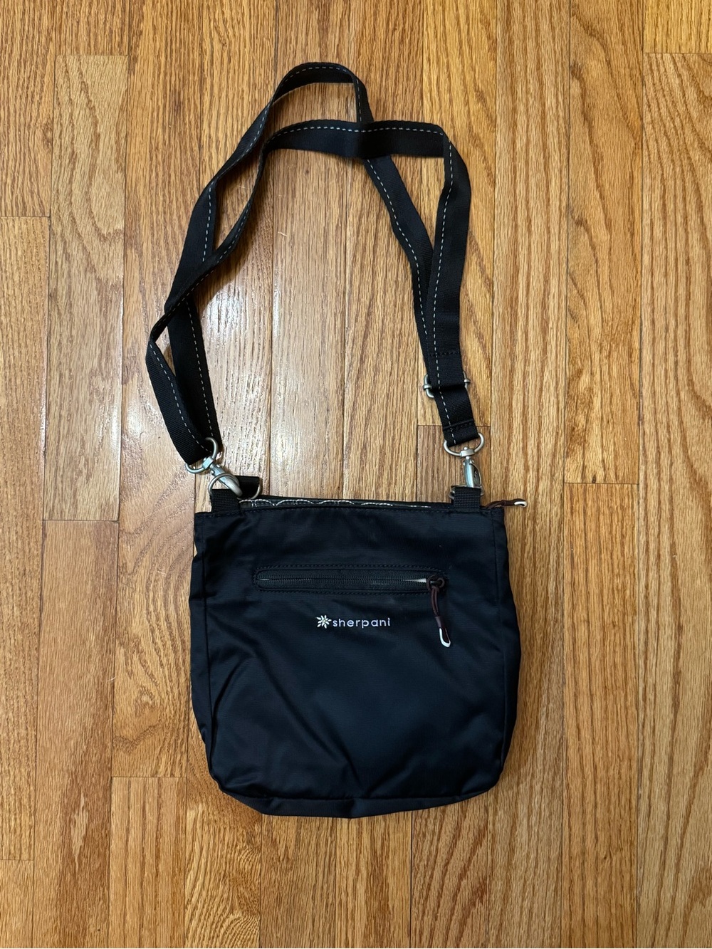 black and gray layered Sherpani crossbody bag